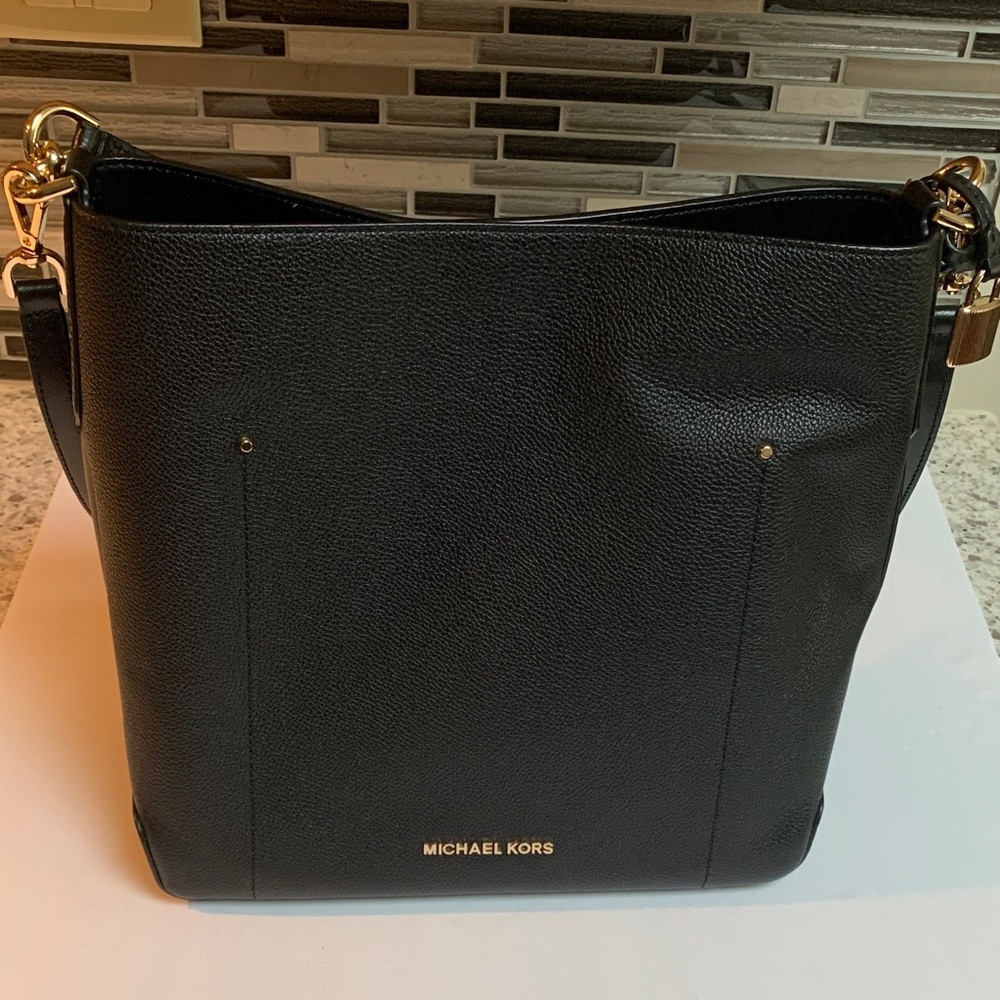 Stylish and Elegant Michael Kors Black Shoulder Bag with Gold Accents. Brand new